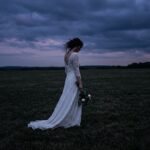 Woman_standing_on_lawn_202607170757